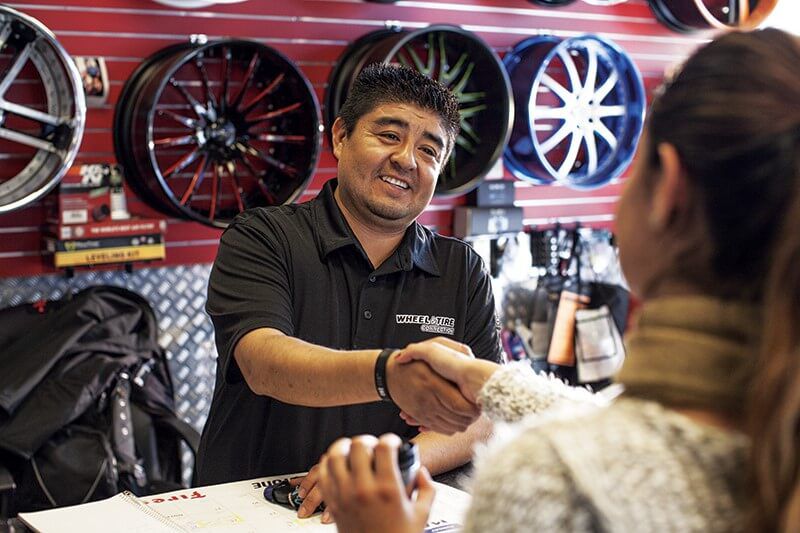 auto working shaking a customers hand auto working shaking a customers hand
