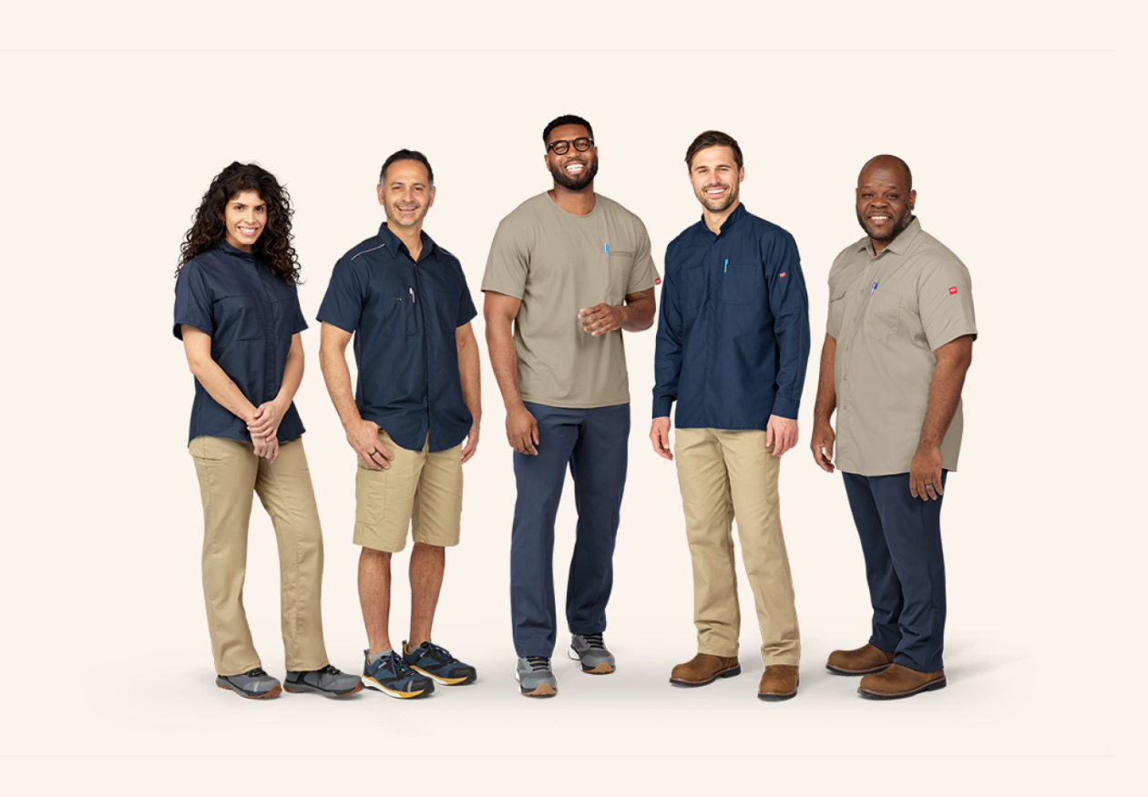 a group of workers smiling while wearing comfortable Red Kap workwear a group of workers smiling while wearing comfortable Red Kap workwear