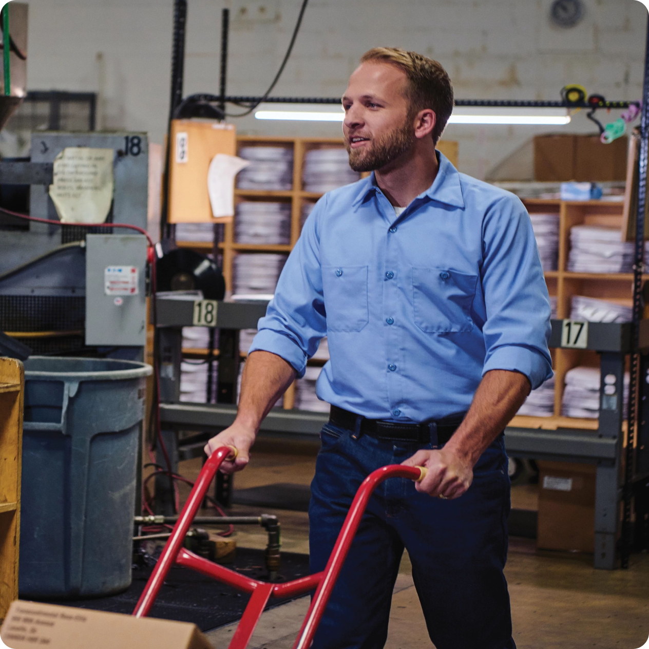 man in a warehouse wearing red kap workwear man in a warehouse wearing red kap workwear